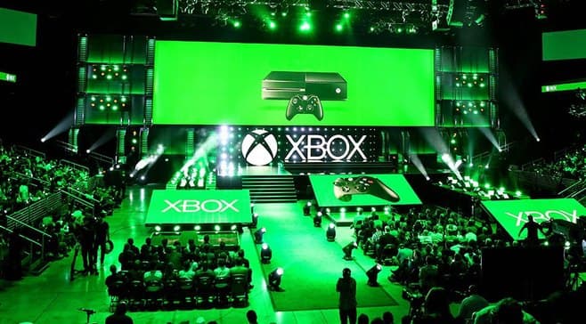 An Xbox showcase stage lit green, the arena floor full in front of it.