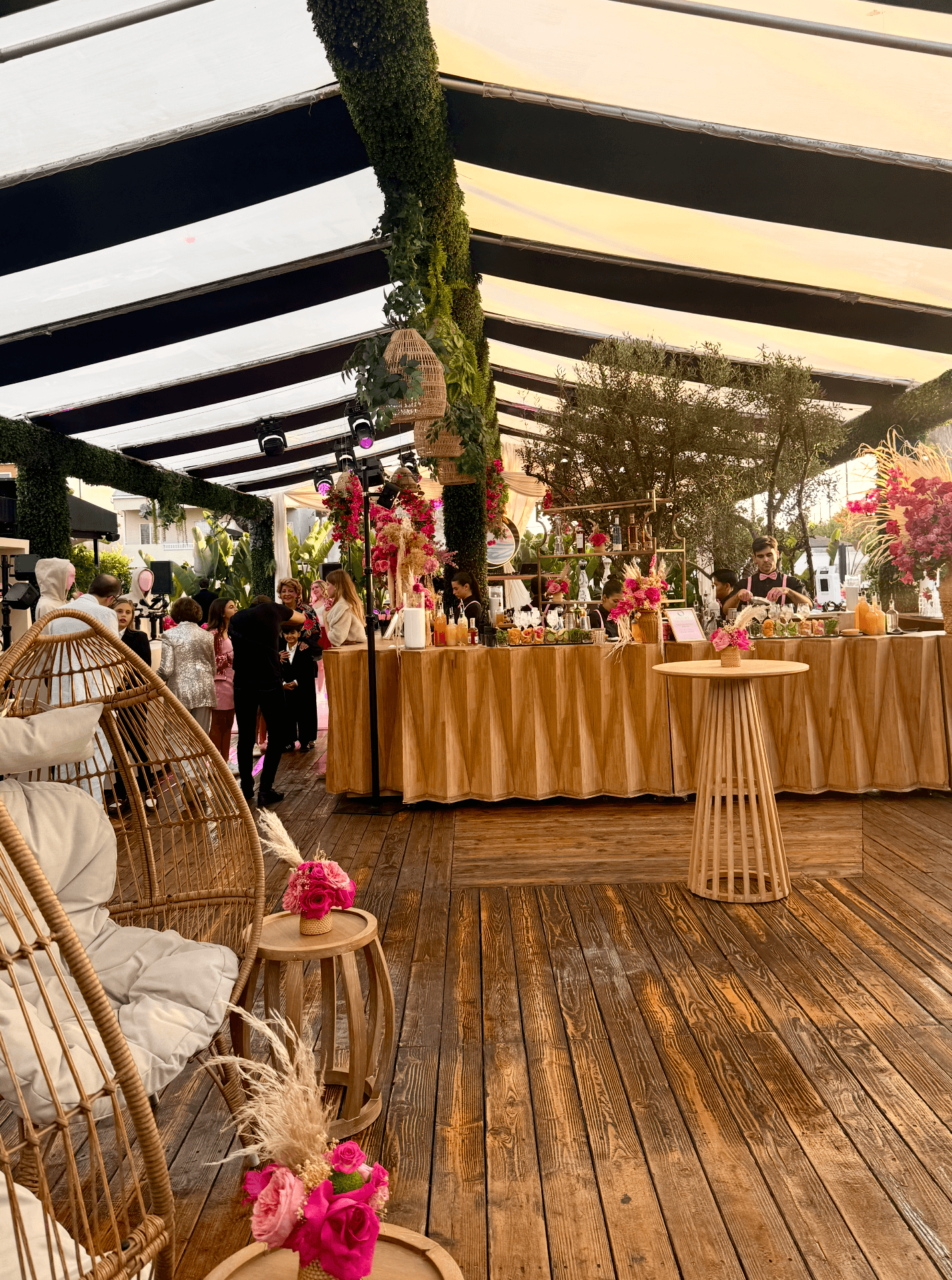 A large banquet with flowers and plants, before the event begins.